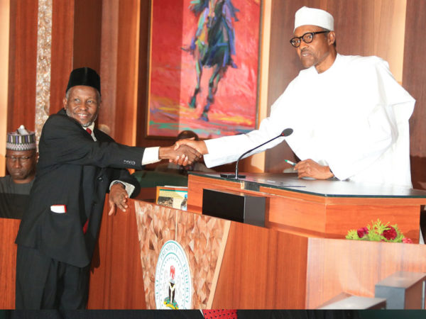Muhammad in a hand shake with Buhari