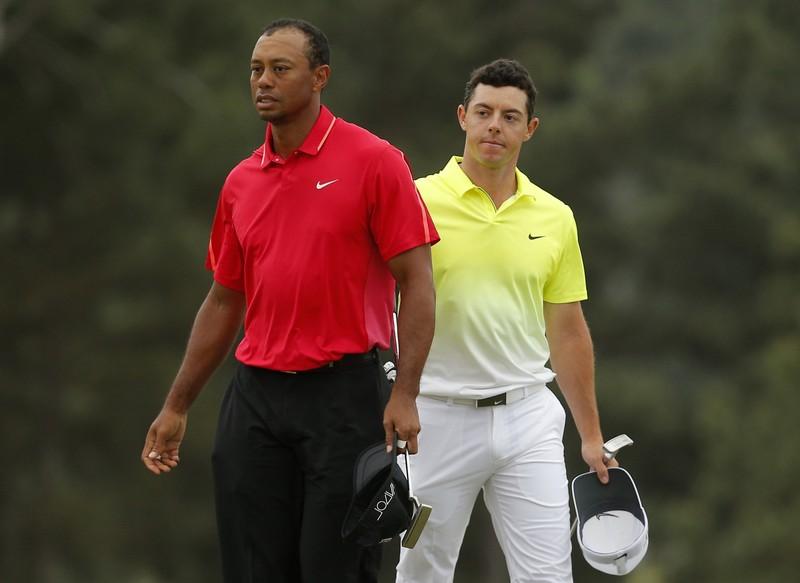 Tiger Woods of the U.S. (L) and Rory McIlroy of Northern Ireland