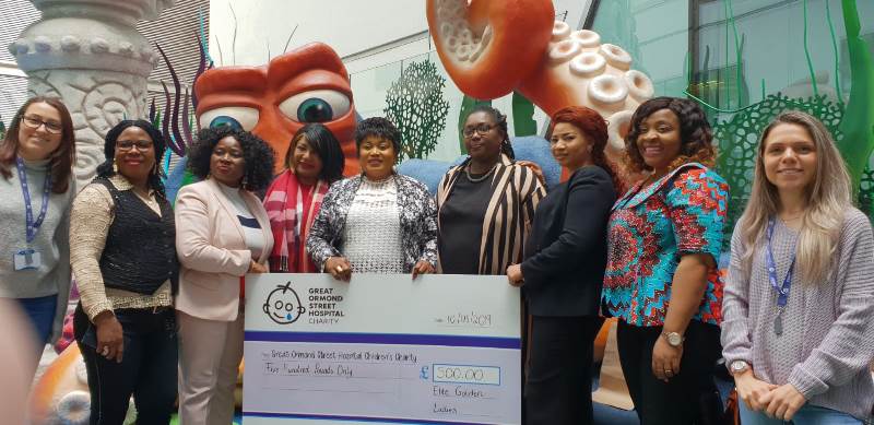 Nkechi Okezuruonye (Middle) and some members of Elite Golden Ladies during their charity visit to Great Ormond Street Children Hospital, UK
