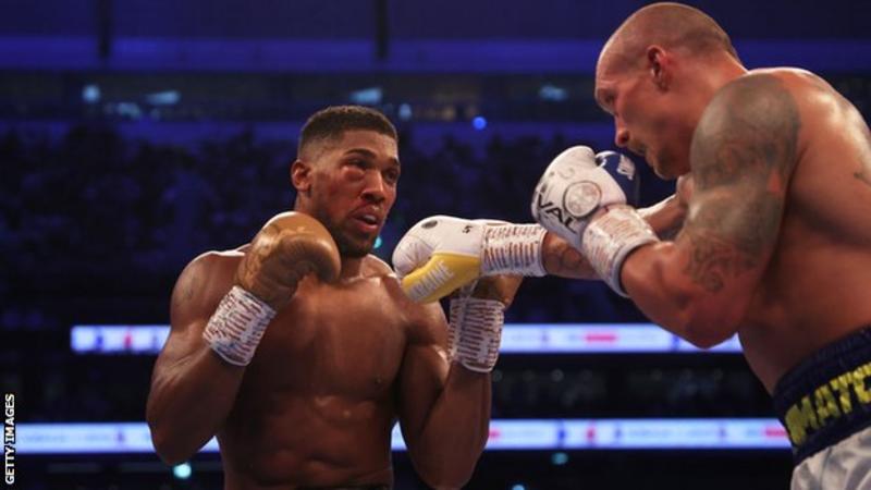 Anthony Joshua (left) lost his WBA, WBO and IBF titles in a unanimous points defeat by Oleksandr Usyk at Tottenham Hotspur Stadium in September.jpg